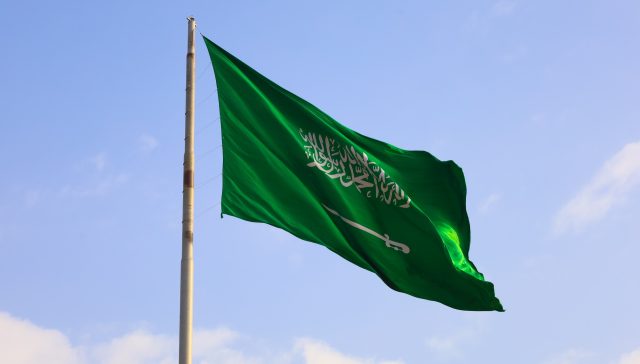 Saudi Arabia national flag waving in sky - Saudi National Day